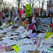 A collection of signs and placards from a women's march