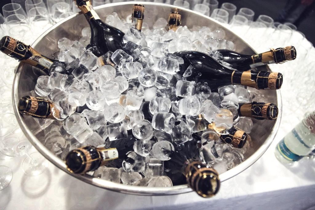 Bucket of iced champagne bottles